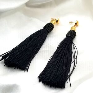 Gold toned toned black tassel string Dangle earrings.